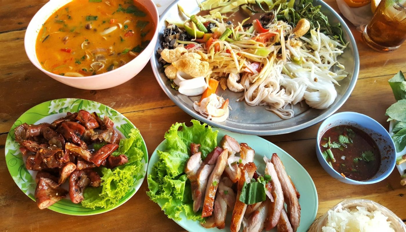 pasta with vegetables near meat with cabbage and stewed food in bowl